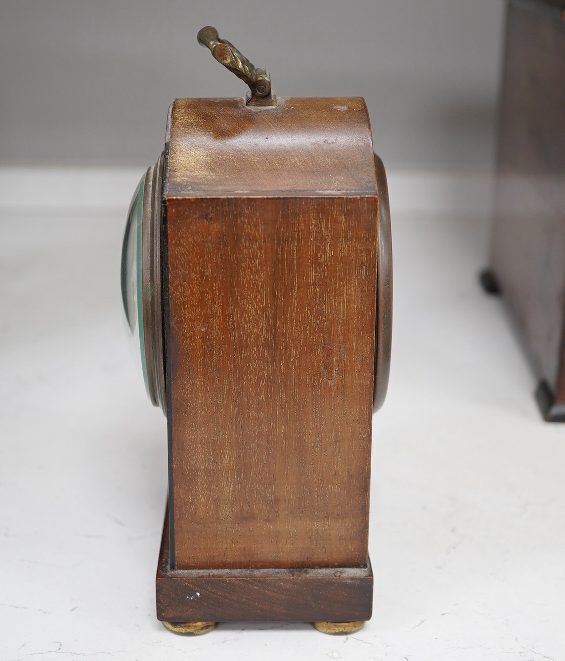 A slate mantel clock and a miniature bracket timepiece, slate clock 25cm high. Condition - miniature bracket time piece, polish on top worn,slate clock has fine scratch.